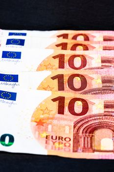 Selective focus on detail of euro banknotes. Close up macro detail of money banknotes, 10 euro isolated. World money concept, inflation and economy concept