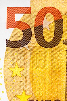 Selective focus on detail of euro banknotes. Close up macro detail of money banknotes, 50 euro isolated. World money concept, inflation and economy concept