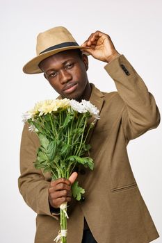Man with a bouquet of flowers date elegant style romance african appearance