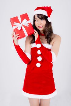 Beautiful portrait young asian woman happy holding red gift box with excited in xmas holiday isolated on white background, asia girl surprise and celebrating in festive Christmas and new year.