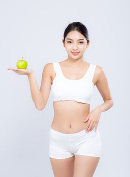 Portrait asian woman smiling holding green apple fruit and beautiful body diet with fit isolated on white background, girl weight slim with cellulite or calories, health and wellness concept.