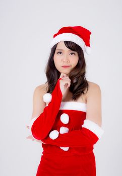 Beautiful portrait young asian woman Santa costume wear hat smiling and thinking in holiday xmas, beauty model asia girl cheerful and happiness celebrating in Christmas isolated on white background.