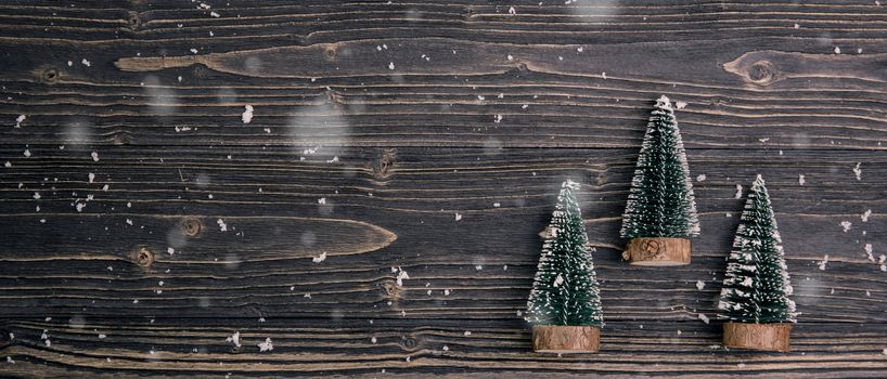 Christmas holiday composition decoration with pine tree on wooden background, new year and xmas or anniversary with presents on wood table in season, top view or flat lay, banner website.