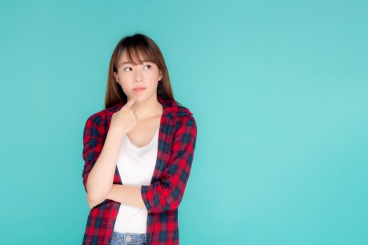 Beautiful portrait young asian woman wear clothes fashion travel thinking idea and enjoy summer holiday isolated blue background, girl smiling confident and cheerful, travel in vacation concept.