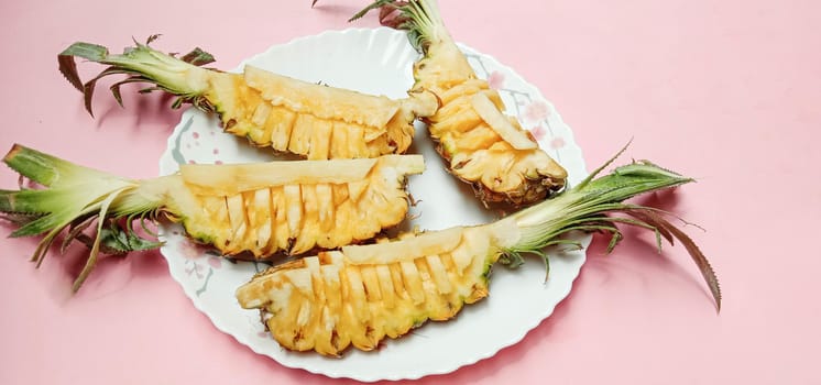 tasty and healthy orange colored pineapple stock on plate