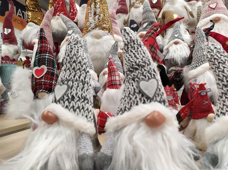 Christmas decorations displayed in a shop, puppets with the features of gnomes