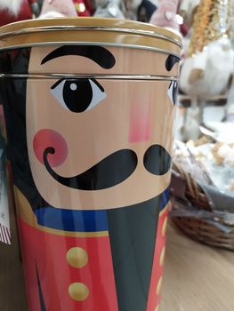 Christmas decorations displayed in a shop, colored tin that reproduces a nutcracker soldier