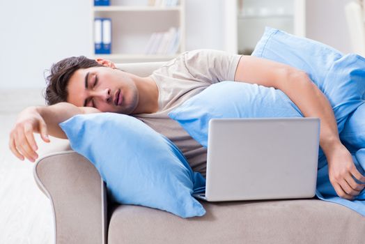 Man working late at his laptop at home
