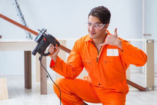 Contractor working on laminate wooden floor