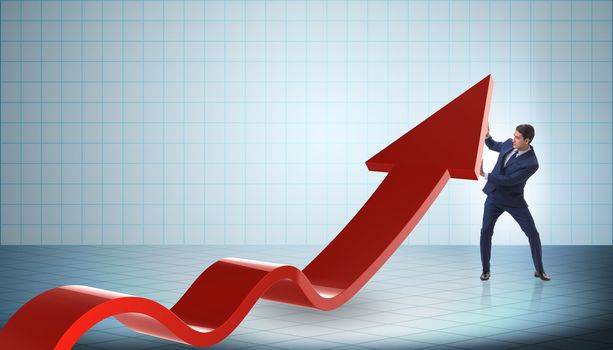 Businessman supporting growtn in economy on chart graph