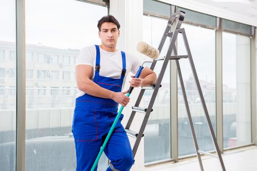 Painter repairman working at construction site