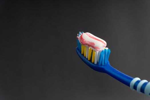 Toothbrush closeup on white background. Healthy concept