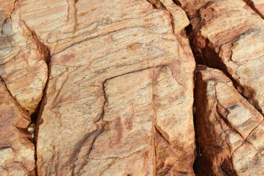 Brown gray granite wall stone background or texture pattern solid nature rock