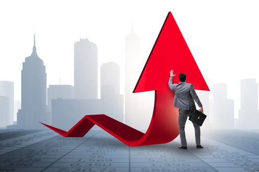 Businessman supporting growtn in economy on chart graph