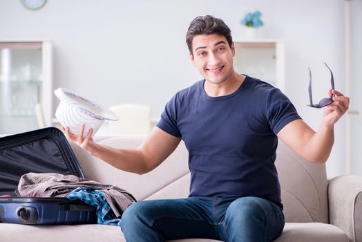 Man with hat preparing for summer vacation