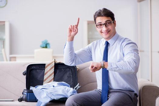 Businessman preparing packing for business trip