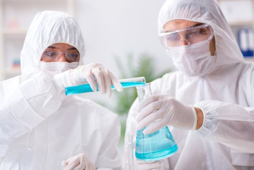 Two chemists working in the lab