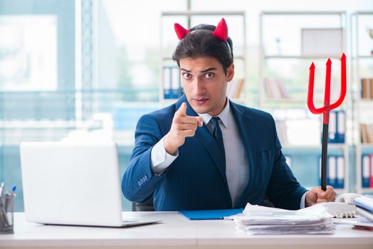 Devil angry businessman in the office