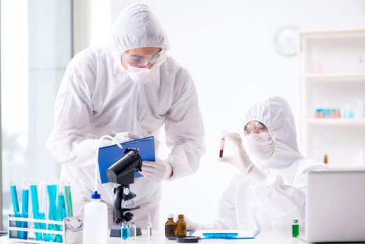 Two chemists working in the lab