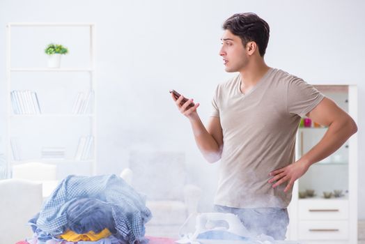 Inattentive husband burning clothing while ironing