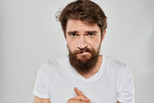 emotional bearded man close-up facial expression studio lifestyle. High quality photo