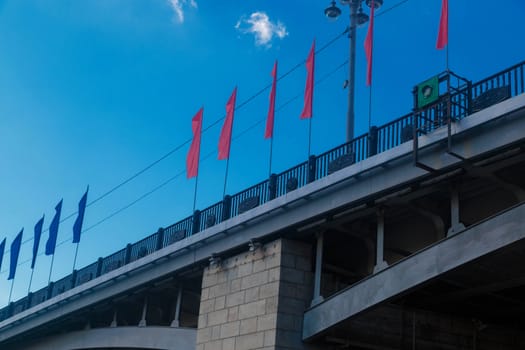 Bridge with flags over the Moskva river in Moscow Russia.