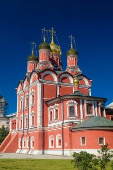 Facade of red brick Christian cathedral building in Moscow.