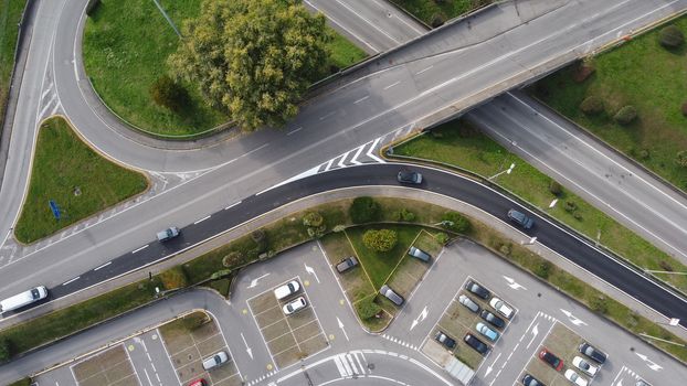 Aerial view of street street and ramps with vehicles driving along them