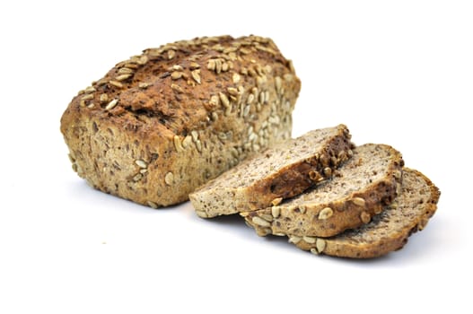 Whole wheat bread with seeds, isolated on white background and slices