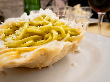 close up of a portion of tonnarelli pasta with cheese and pepper sauce. typical Roman recipe