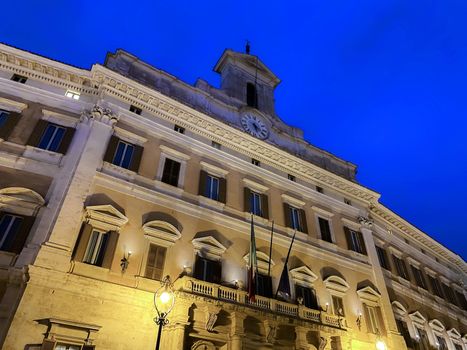 Night view of Palazzo Montecitorio in Rome, seat of the Chamber of Deputies of the Italian Republic. Democracy and politics. Parliamentary representation