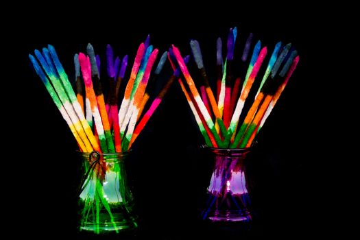 Colored and fragrance handmade incense sticks on black background