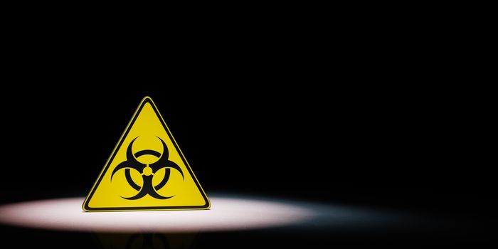 Black and Yellow Pandemic Symbol Warning Triangle Spotlighted on Black Background with Copy Space Render Illustration