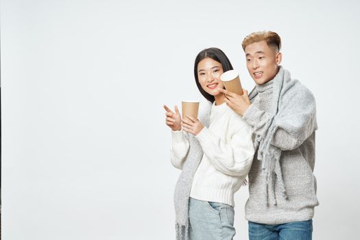 Man and woman warm drink sweaters coolness winter fashion