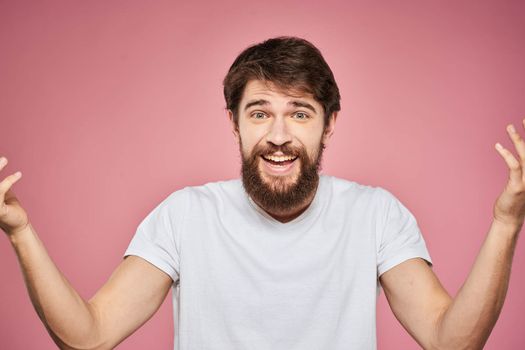 cute bearded men white t-shirt studio pink isolated background. High quality photo