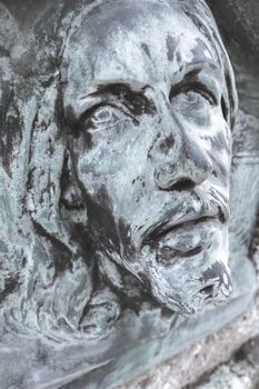 Bas-relief of Jesus. Antique statue of Jesus Christ face. Religion, vintage, faith, history, suffering concept.