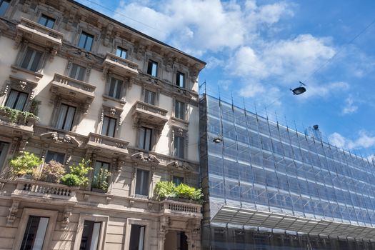 Scaffolding on a historic Italian palace, building under renovation.