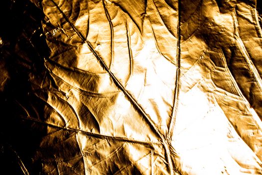 A gold Holographic Foil Leaf and Leaves with Veins Texture Shiny Pattern