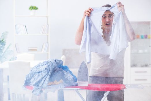 Inattentive husband burning clothing while ironing