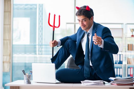 Devil angry businessman in the office