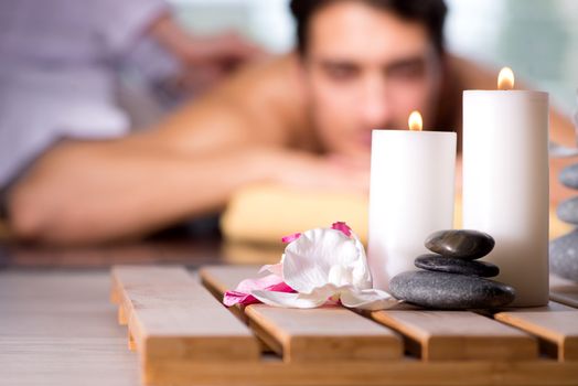 Young handsome man during spa procedure