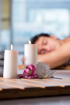 Young handsome man during spa procedure