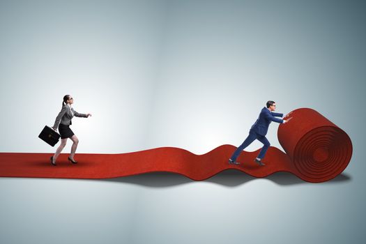 Business people in success concept with red carpet