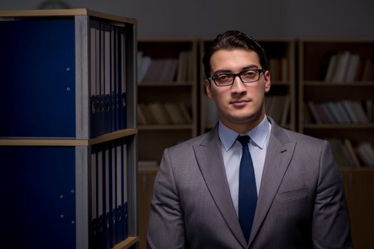 Businessman working late hours in the office