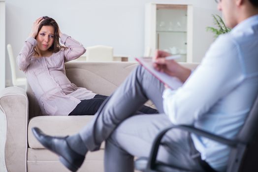 Pregnant woman visiting psychologist doctor