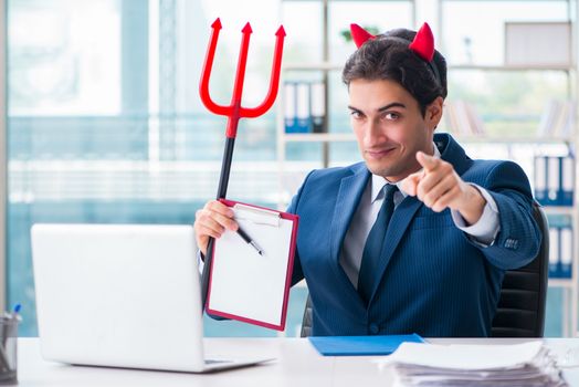 Devil angry businessman in the office