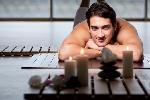 Young handsome man during spa procedure