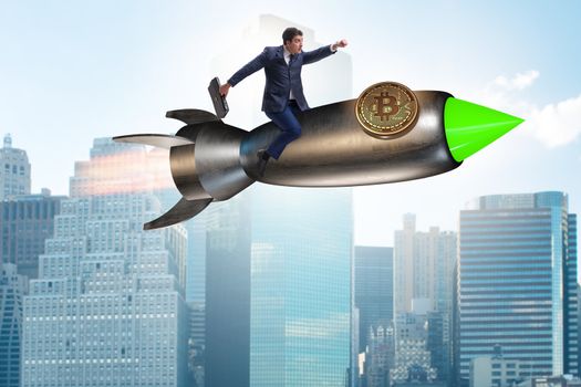 Businessman flying on rocket in bitcoin price rising concept