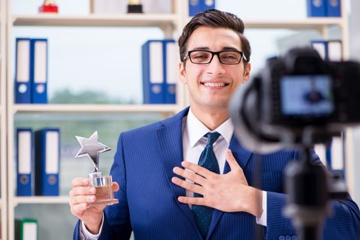Businessman recording a video for vlog