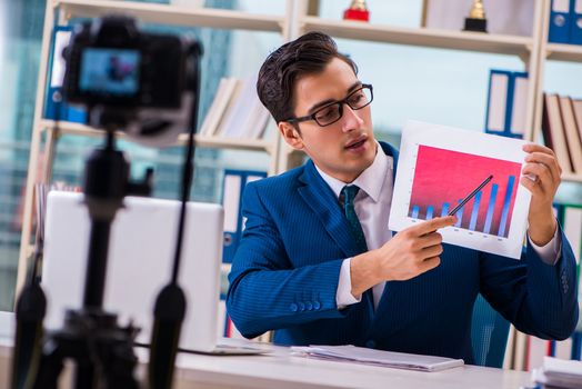 Businessman recording a video for vlog